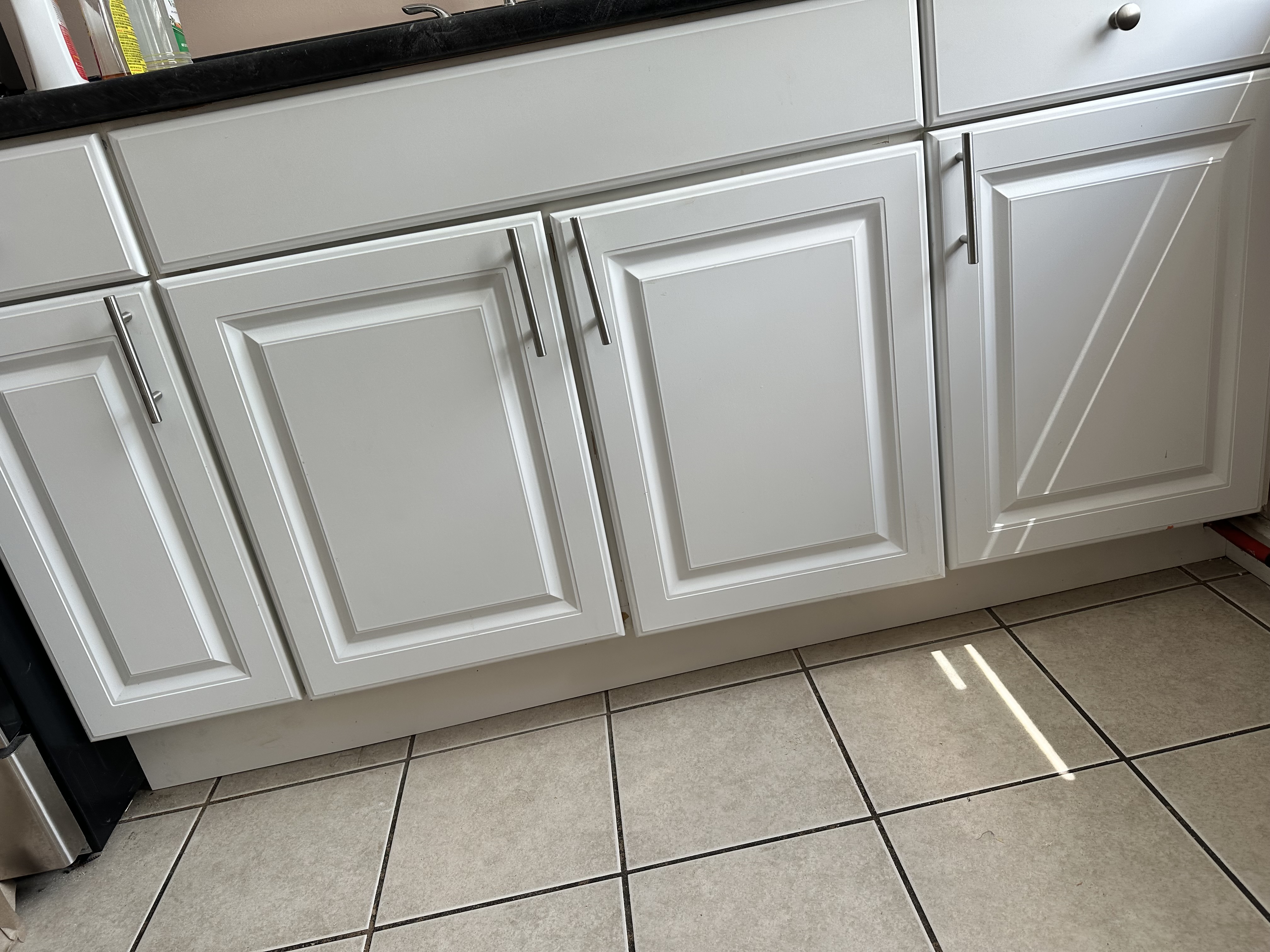 Restored cabinet doors and toe-kick after final cleanup