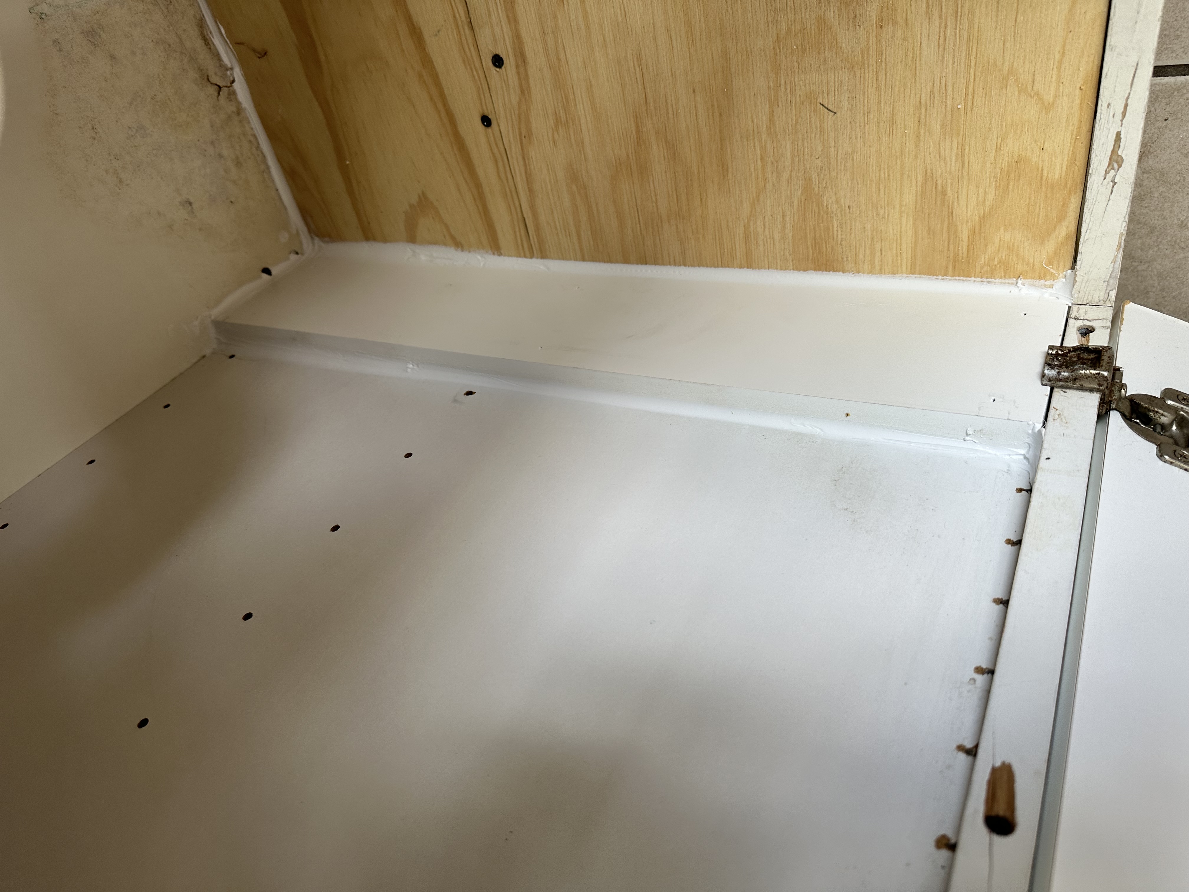 Moisture-resistant sealing along the repaired cabinet base edge